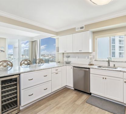 Your gourmet kitchen awaits with granite counters, stainless appliances, and stunning city views—perfect for cooking while soaking in the scenery.