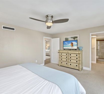 Your spacious master bedroom features a comfortable king bed, smart TV for evening relaxation, and gentle ceiling fan to keep you cool throughout the night.