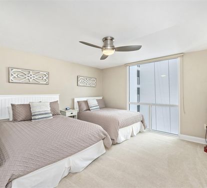 Drift off to sleep in your comfortable twin bedroom, featuring coastal charm and a gentle ceiling fan to keep you cool all night.
