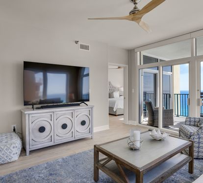 Living Area with Flat Screen TV and Electric Blinds