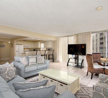 Sink into soft gray sofas and watch your favorite shows while city views stretch beyond the windows.