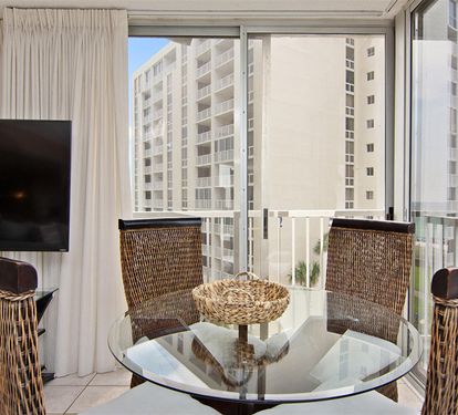 Enjoy morning coffee at your glass dining table while taking in city views from your private balcony sanctuary.