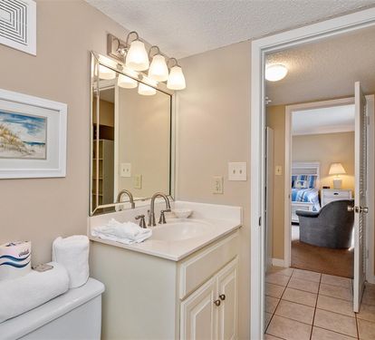Your well-appointed bathroom features marble countertops, quality fixtures, and thoughtful lighting to start your mornings perfectly.