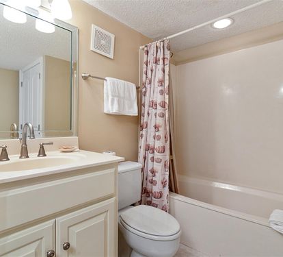 Your private bathroom features a full tub for relaxing soaks, plus fresh towels and all the essentials you need.