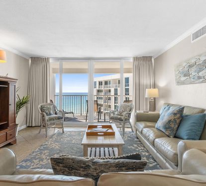 Sink into plush leather seating while ocean waves sparkle beyond your floor-to-ceiling windows, creating the perfect coastal retreat.