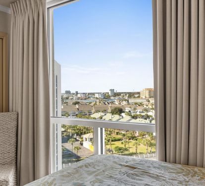Wake up to stunning city views through your floor-to-ceiling windows, where natural light floods your peaceful bedroom retreat.
