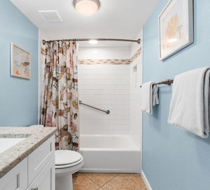 Refresh in your private bathroom with calming blue walls, granite counters, and a spacious tub-shower combo for relaxing soaks.