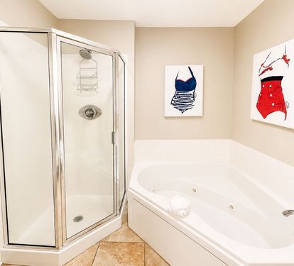 Lighthouse 1710 Primary Bathroom with Step-in Shower and Jetted Tub