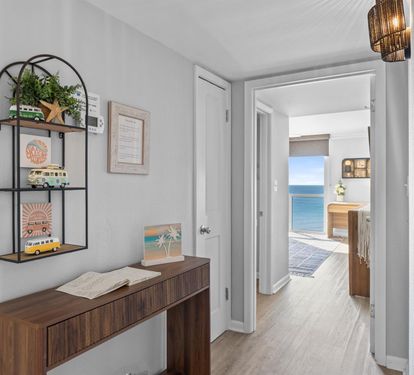 Step into your coastal retreat where ocean views greet you through every doorway, creating seamless indoor-outdoor flow.