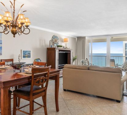 Your oceanfront retreat features elegant dining and living spaces with breathtaking sea views stretching endlessly beyond your private balcony.