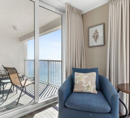 Unwind in your cozy reading nook with ocean views through floor-to-ceiling windows, then step onto your private balcony for fresh sea air.