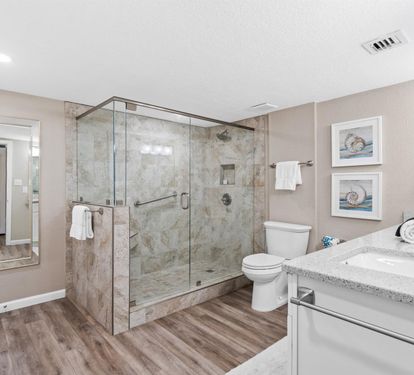 Unwind in your elegant ensuite with luxurious marble shower, granite countertops, and plush towels waiting for your arrival.