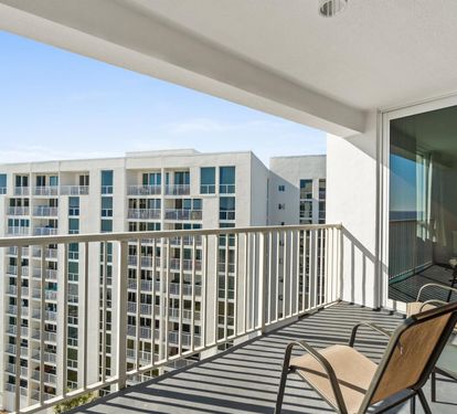 Relax on your private balcony with stunning ocean views and comfortable seating - your perfect retreat to watch the waves.