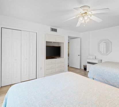 Drift off to peaceful sleep in your bright, airy bedroom with twin beds, built-in entertainment center, and ample closet space for all your vacation essentials.