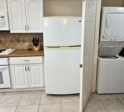 Your fully equipped kitchen features everything you need, plus convenient in-unit laundry to keep your stay comfortable and hassle-free.