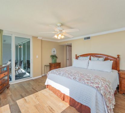 Drift off in your serene bedroom with rich wood furnishings and sliding doors that open to your private balcony retreat.