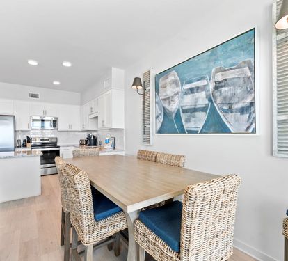 Your bright dining area flows seamlessly into the modern kitchen, creating the perfect space for memorable meals together.
