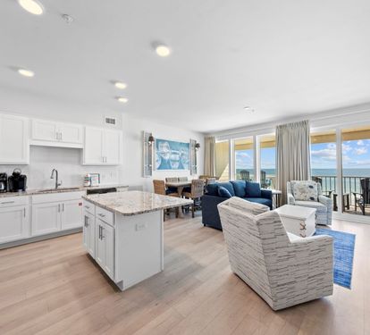 Your stunning oceanfront retreat features an open-concept space where you'll cook, dine, and relax while soaking in breathtaking sea views through floor-to-ceiling windows.