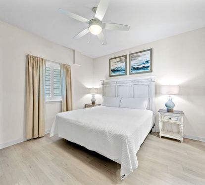 Drift off peacefully in your bright, airy bedroom with soft coastal touches and gentle ceiling fan.
