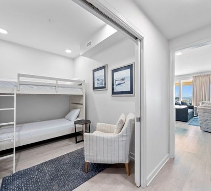 Your cozy bunk room features built-in storage and comfortable seating, perfect for kids or extra guests to unwind.