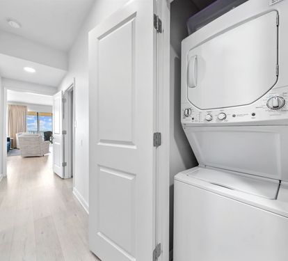 Your laundry needs are covered with this convenient in-unit washer and dryer, tucked away yet easily accessible from your bright hallway.