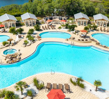 Aerial view of an expansive resort-style pool complex with Pool Cabana's
