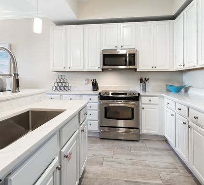 Step into your bright, fully equipped kitchen with stainless steel appliances, marble countertops, and all the tools you need to whip up delicious meals at home.