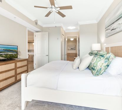 Unwind in your serene bedroom with plush linens, soothing coastal accents, and a bright, airy ambiance that invites restful nights and refreshing mornings.