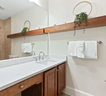 Refresh in your modern bathroom with dual sinks, fresh towels, and natural touches that make your stay feel like home.