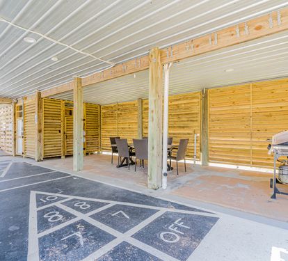 Blue Lagoon Shuffleboard + Covered Outdoor Table + Grill