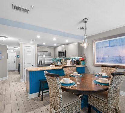 Plenty of dining room seating and a modern kitchen invite you to whip up meals together.
