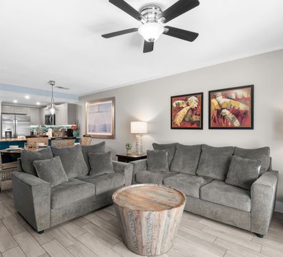 Sink into plush sofas in your open-plan living area, where soothing tones create a welcoming retreat after a full day of exploring.