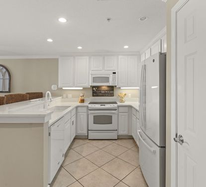 Cook your favorite meals in this bright, fully-equipped kitchen with modern appliances and plenty of counter space for prep work.