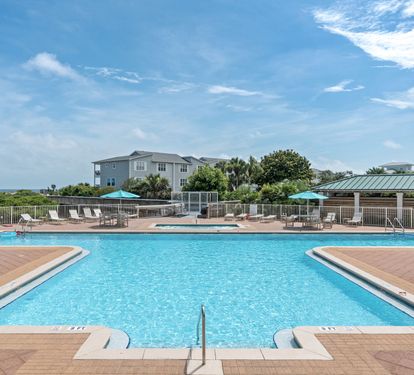 Dive into crystal-clear waters surrounded by swaying palms and coastal breezes. Lounge poolside under bright turquoise umbrellas, soak up the sun, and let your worries drift away in this serene oasis.