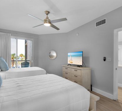 TV and Private Patio Access in Bedroom 2