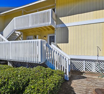 Front of condo. Steps leading to front door