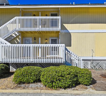 Front of condo. Steps leading to front door