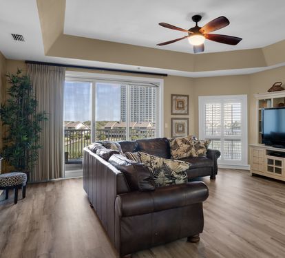 Living Area with Balcony Access and Large TV