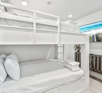 Your cozy bunk bed retreat offers crisp linens and modern comfort, perfect for sharing adventures with family or friends.