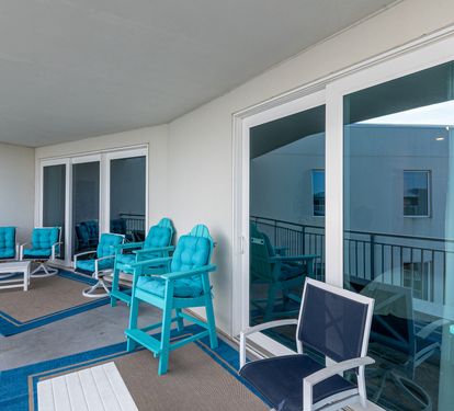 Your spacious balcony features vibrant turquoise seating where you can relax and unwind with plenty of room to spread out.