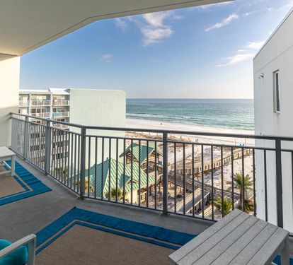 Wake up to breathtaking ocean views from your private balcony, where turquoise waters meet endless sky just steps away.