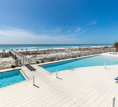Beachfront pools with direct access to pristine white sand and emerald waters create the perfect coastal retreat.