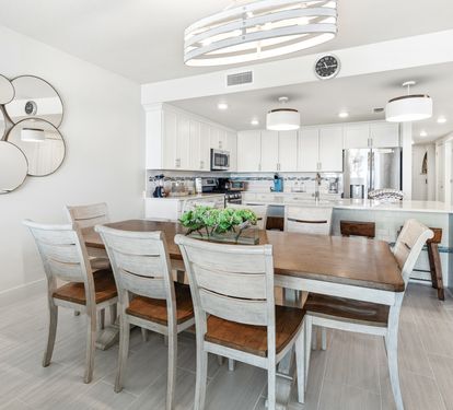 Gather around this stunning dining table where your group can share meals in this bright, modern space with a fully equipped kitchen.