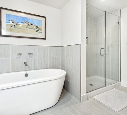 Unwind in your spa-like bathroom with a luxurious soaking tub and spacious glass shower, creating the perfect retreat after your adventures.