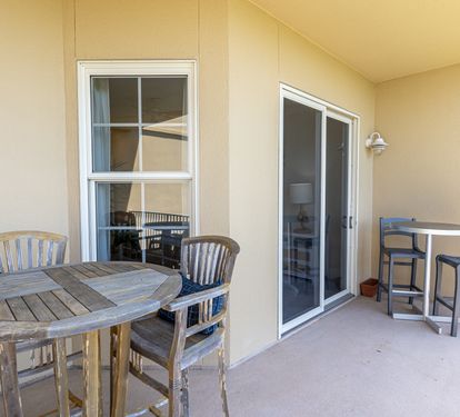 Step onto your private covered balcony where two seating areas invite you to savor morning coffee or evening conversations in the fresh air.