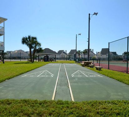 Shuffleboard courts at Sandpiper Cove Resort, providing a fun, laid-back way to enjoy friendly competition and relaxed outdoor time in a sunny coastal setting.