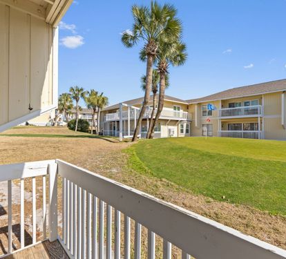 Enjoy peaceful resort views from the private patio overlooking the lush grounds and golf course area at Sandpiper Cove Resort. This relaxing outdoor space is perfect for morning coffee, evening drinks, and soaking in the coastal atmosphere.