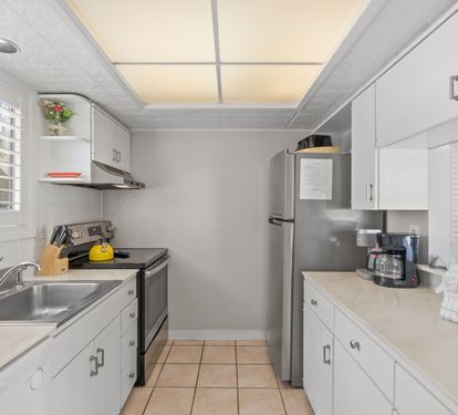 Your fully equipped galley kitchen features modern appliances, ample counter space, and everything you need to prepare meals during your stay.