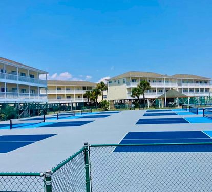 Pickleball courts at Sandpiper Cove Resort offering a fun, active way to enjoy the coastal sunshine, with well-maintained courts and a relaxed resort atmosphere perfect for all skill levels.