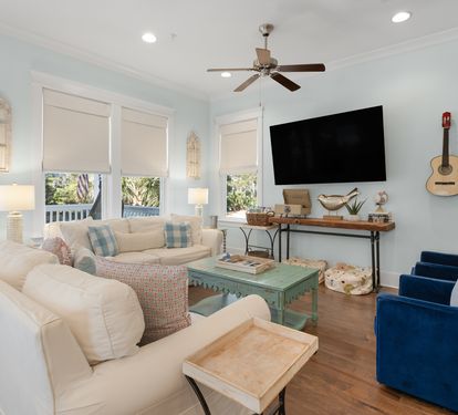 Sink into plush seating while coastal breezes flow through your bright living space, complete with entertainment and charming nautical touches.
